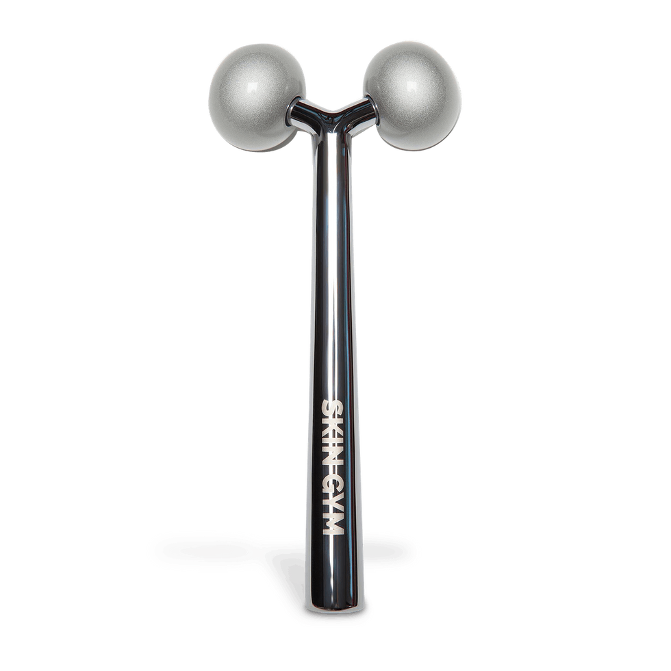 A black stick with 2 silver balls that says "Skin Gym"