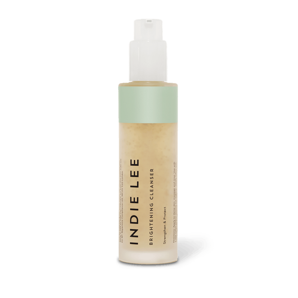 A light orange bottom of the Indie Lee Brightening Cleanser