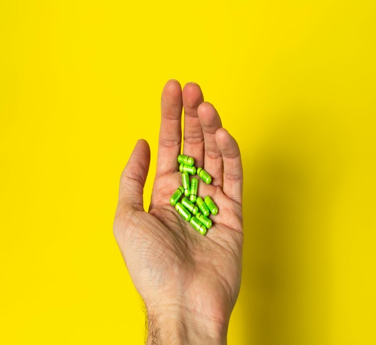 Kratom capsules in a bowl